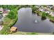 An aerial shot of the community pond with a fountain, landscaping, and a gazebo at 1943 Blue Heron Way, Lawrenceville, GA 30043