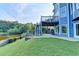 Home's rear exterior features a deck and stairs leading down to the yard at 1943 Blue Heron Way, Lawrenceville, GA 30043