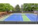 View of the tennis courts with benches and lighting available for residents and guests at 1943 Blue Heron Way, Lawrenceville, GA 30043