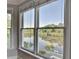 Bright windows offers scenic view of lake, trees and deck at 1943 Blue Heron Way, Lawrenceville, GA 30043