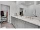 Modern bathroom boasts double vanity, large mirror and a walk-in closet view at 230 New St # 1303, Decatur, GA 30030