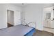 Bedroom with metal bed frame, wood floors, and ensuite bathroom at 230 New St # 1303, Decatur, GA 30030