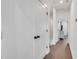 Hallway with dark hardwood floors that leads to rooms in the home at 230 New St # 1303, Decatur, GA 30030