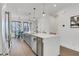 Sleek kitchen featuring stainless steel appliances, a large island, and pendant lighting at 230 New St # 1303, Decatur, GA 30030