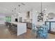 Modern kitchen with stainless steel appliances, white countertops, and an island with bar seating at 230 New St # 1303, Decatur, GA 30030