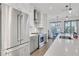 Contemporary kitchen showcasing stainless steel appliances, white countertops, and a modern faucet at 230 New St # 1303, Decatur, GA 30030