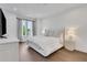 Serene main bedroom with a plush bed, soft lighting, and large windows with flowing curtains at 230 New St # 1303, Decatur, GA 30030