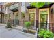 A row of three-story townhomes with brick facades, covered entries, and manicured landscaping at 230 New St # 1303, Decatur, GA 30030