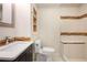 Bathroom features a modern vanity, toilet, and tiled shower with a built-in seat at 3492 Ember St, Marietta, GA 30066
