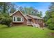 Charming single-Gathering home with a well-manicured lawn, inviting bay window and a classic, brown exterior at 3492 Ember St, Marietta, GA 30066
