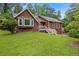 Charming single-Gathering home with a well-manicured lawn, inviting bay window and a classic, brown exterior at 3492 Ember St, Marietta, GA 30066