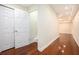Hallway features beautiful hardwood floors, recessed lighting, and white closet doors at 3492 Ember St, Marietta, GA 30066