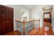 Inviting foyer featuring gleaming hardwood floors, staircase, and a glimpse into a well-appointed kitchen at 3492 Ember St, Marietta, GA 30066