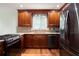 This gourmet kitchen offers granite countertops, stainless steel appliances, mosaic backsplash, and rich wood flooring at 3492 Ember St, Marietta, GA 30066