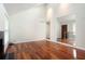 Bright living room featuring gleaming wood floors, fireplace, and open design with vaulted ceilings at 3492 Ember St, Marietta, GA 30066