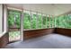 Screened porch with views of green, wooded backyard at 3492 Ember St, Marietta, GA 30066