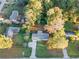 An aerial view of a single-story home with mature trees and a well-maintained lawn at 4781 Brownsville Rd, Powder Springs, GA 30127