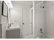 Bathroom with white tiled walls, a shower/tub combo, and a modern vanity at 4781 Brownsville Rd, Powder Springs, GA 30127