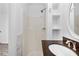 Bathroom featuring a shower, built-in shelves, and an oval mirror at 4781 Brownsville Rd, Powder Springs, GA 30127