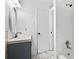 Well-lit bathroom featuring a shower and modern vanity at 4781 Brownsville Rd, Powder Springs, GA 30127