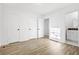 A bright room with hard floors and neutral paint, and a connected bathroom at 4781 Brownsville Rd, Powder Springs, GA 30127