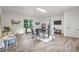 Bright and airy dining room with modern furniture, large windows, and sleek flooring at 4781 Brownsville Rd, Powder Springs, GA 30127