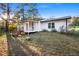 Charming home exterior with a cozy porch and inviting backyard at 4781 Brownsville Rd, Powder Springs, GA 30127