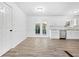 Bright kitchen with stainless steel appliances, stone countertops, and open access to the dining area at 4781 Brownsville Rd, Powder Springs, GA 30127