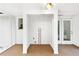 Bright laundry area featuring white walls, utility connections, and easy access to the exterior of the home at 4781 Brownsville Rd, Powder Springs, GA 30127