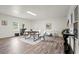Spacious living room with modern furniture, bright lighting, and hardwood floors, perfect for entertaining at 4781 Brownsville Rd, Powder Springs, GA 30127