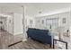 Living room with gray toned flooring, white ceilings and walls, stylish decor, and cozy lighting at 4781 Brownsville Rd, Powder Springs, GA 30127