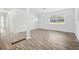 Spacious living space featuring new flooring and paint throughout, with a bright front door and large window at 4781 Brownsville Rd, Powder Springs, GA 30127