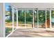 Covered, screened-in porch offers views of the backyard at 4781 Brownsville Rd, Powder Springs, GA 30127