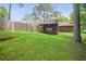 Large grassy backyard and screened-in porch is a great outdoor entertaining space at 6134 Silver Spur Dr, Lithonia, GA 30058