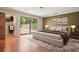 Stylized primary bedroom features a sliding glass door and walk-in closet at 6134 Silver Spur Dr, Lithonia, GA 30058