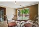 Cozy breakfast nook features a sliding glass door and seating for four at 6134 Silver Spur Dr, Lithonia, GA 30058