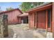 Entrance features wood door, stone accent, and walkway leading to well-maintained yard at 6134 Silver Spur Dr, Lithonia, GA 30058