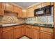 A well-lit kitchen with granite countertops and stainless steel appliances at 6134 Silver Spur Dr, Lithonia, GA 30058