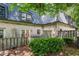 A charming brick townhouse featuring a cozy, fenced-in yard with lush greenery for serene outdoor living at 104 Verlaine Nw Pl, Atlanta, GA 30327