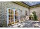 Backyard patio area with brick walls and french doors at 104 Verlaine Nw Pl, Atlanta, GA 30327