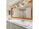 Bathroom with an oversized vanity mirror, modern lighting and a shower with tile surround at 104 Verlaine Nw Pl, Atlanta, GA 30327