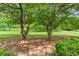 Lush green golf course view framed by mature trees offering a serene and picturesque setting at 104 Verlaine Nw Pl, Atlanta, GA 30327