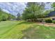 Well-manicured green with disc golf target, showcasing a recreational amenity within a landscaped setting at 104 Verlaine Nw Pl, Atlanta, GA 30327