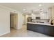 Bright kitchen features stainless steel appliances, white cabinets and subway tile backsplash at 104 Verlaine Nw Pl, Atlanta, GA 30327