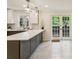 Modern kitchen featuring stainless steel appliances, quartz countertops, and stylish lighting at 104 Verlaine Nw Pl, Atlanta, GA 30327