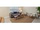 Open-concept living room featuring neutral colors, large windows, and hardwood floors at 104 Verlaine Nw Pl, Atlanta, GA 30327
