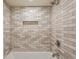 Tile shower featuring a built in niche and shower head at 104 Verlaine Nw Pl, Atlanta, GA 30327