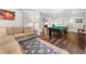 Basement with a pool table, a couch and unique guitar wall art at 112 Pebblebrooke Run, Canton, GA 30115