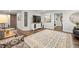 Open basement living area with luxury vinyl flooring, a cozy seating area, area rug, and decorative features at 112 Pebblebrooke Run, Canton, GA 30115