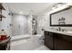 Bathroom featuring a tiled stand-up shower and modern fixtures at 112 Pebblebrooke Run, Canton, GA 30115